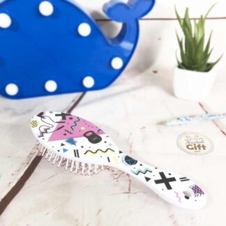 Petite brosse à cheveux style années 80