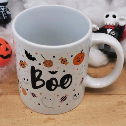 Mug Halloween Boo et ses bonbons Tarentules noires, dentiers et guimauves citrouille et tête de mort