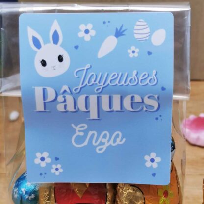 Sachet "Joyeuses Pâques" bleu personnalisé - 10 Oeufs pralinés, 10 oeufs croustillants et 2 lapins en chocolat (25g)