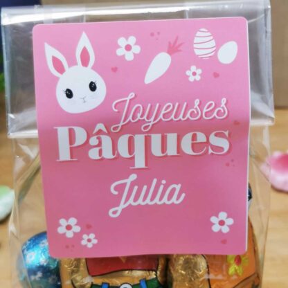 Sachet "Joyeuses Pâques" rose personnalisé - 10 Oeufs pralinés, 10 oeufs croustillants et 2 lapins en chocolat (25g)